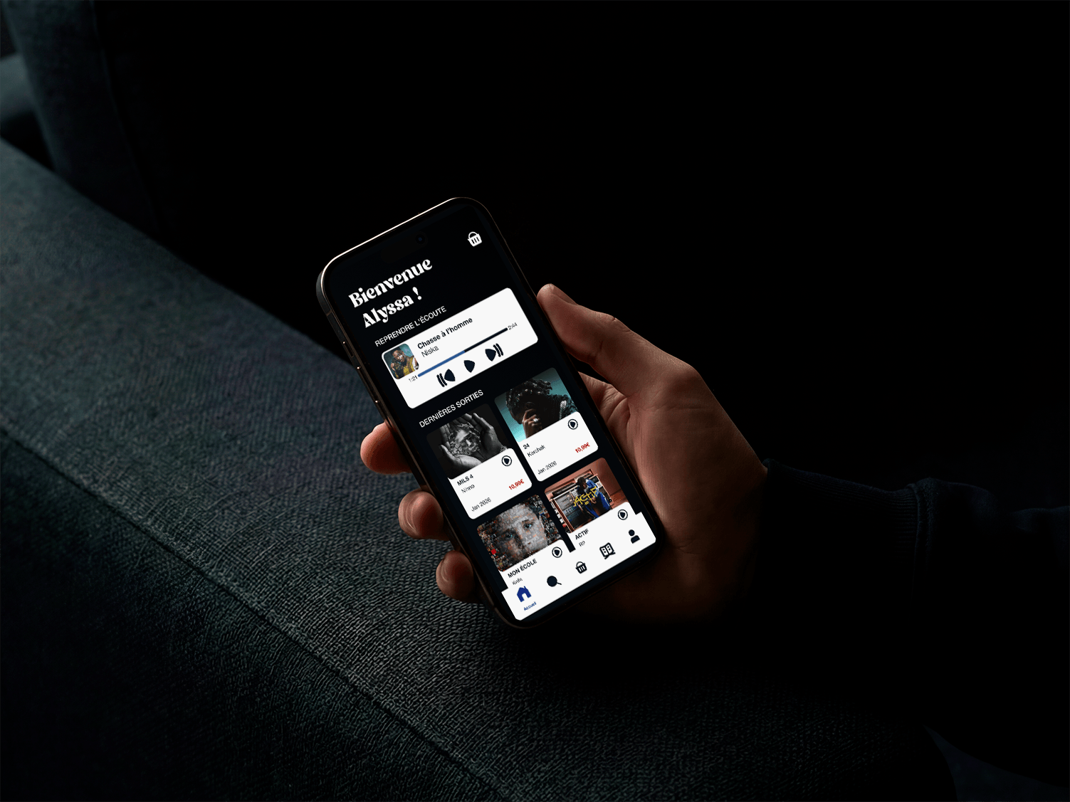 A phone held in one hand, displaying the SoundRap homepage